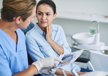 Patient in Garland at dentist needing a tooth extraction