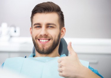 Patient in Garland at dentist needing a tooth extraction