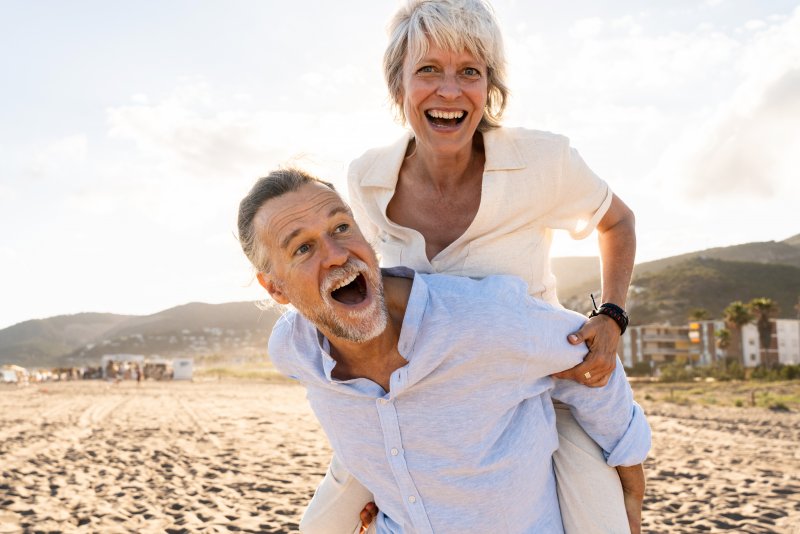 a mature couple spending time at the beach